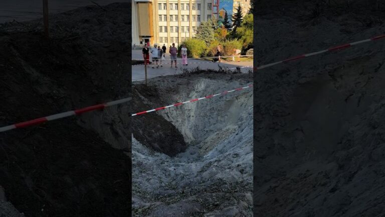 A toddler is learning to walk beside the crater left after Russia’s attack on Ukraine